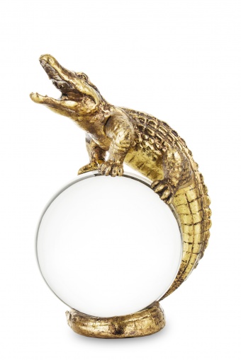 Figurine of a crocodile on a crystal ball