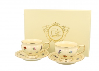En set of 2 cups of espresso with a saucer. England